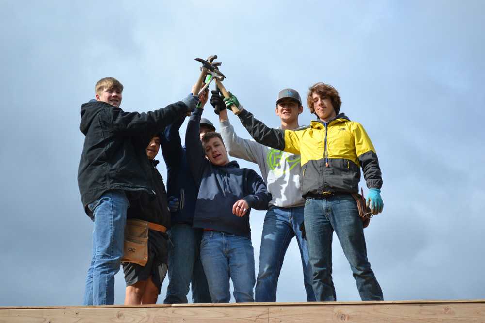 Crosshill Christian's senior soccer players used their hammers to nail a service project to benefit wildfire victims