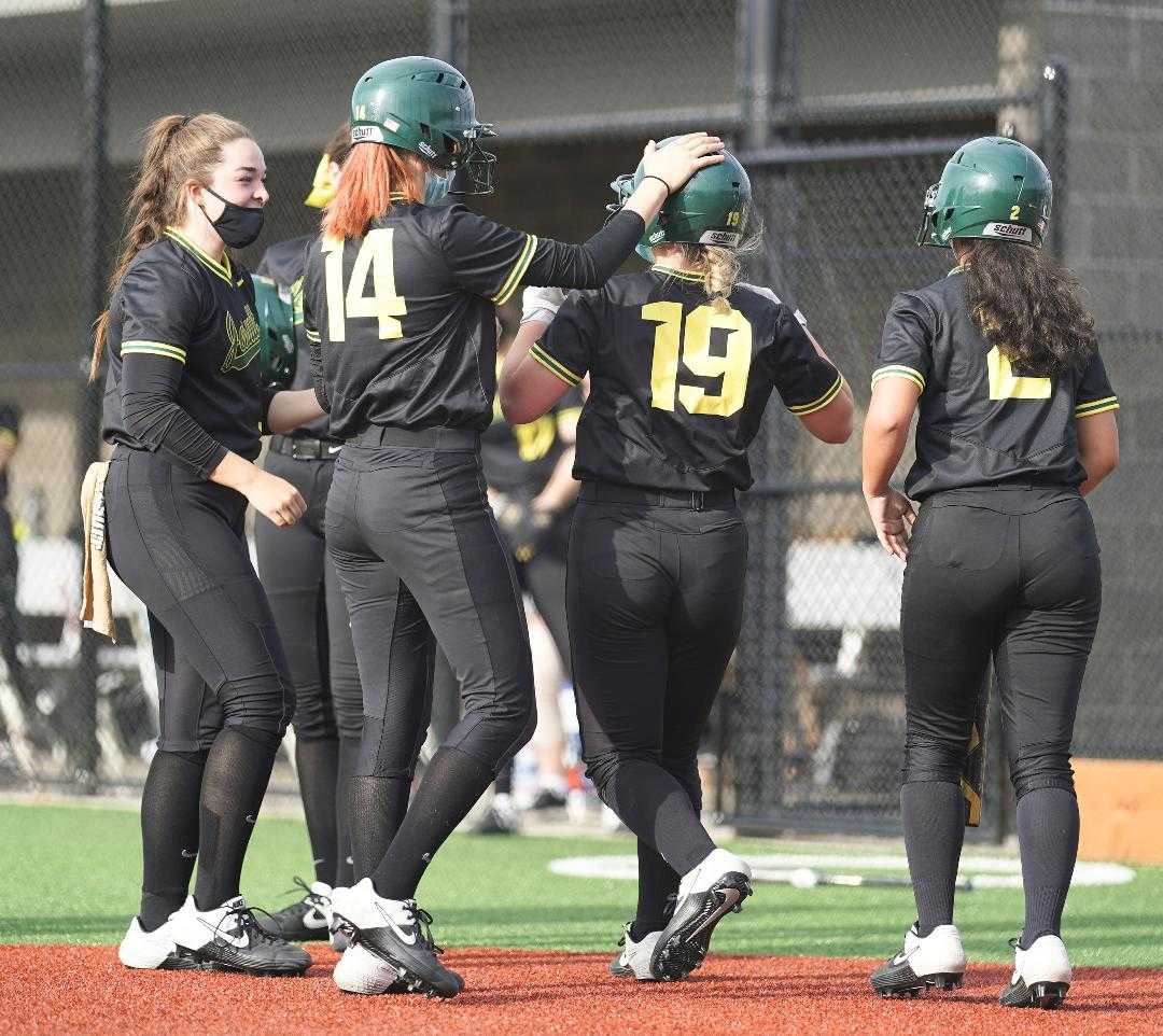 Mary Cunningham (19) and Ellie McClaskey (14) hit home runs for Jesuit at Mountainside. (Photo by Jon Olson)