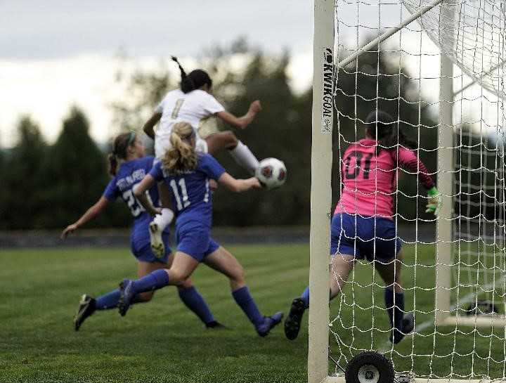 Marist Catholic's Cloe Chase (1) converted a volley into her team's first goal Monday at Catlin Gabel. (Photo by Jon Olson)