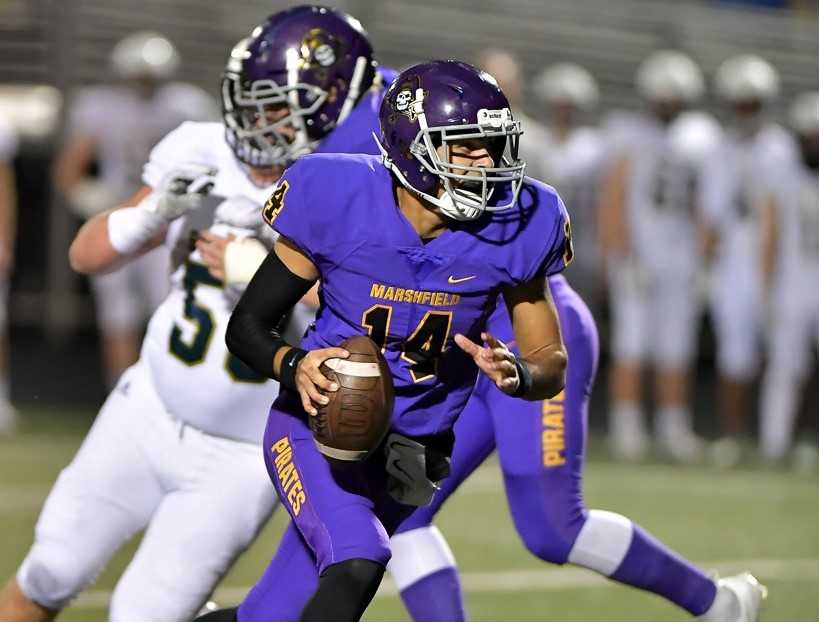 Marshfield senior Dom Montiel threw for 439 yards and ran for 121 yards in Saturday's win. (Photo by Andre Panse)