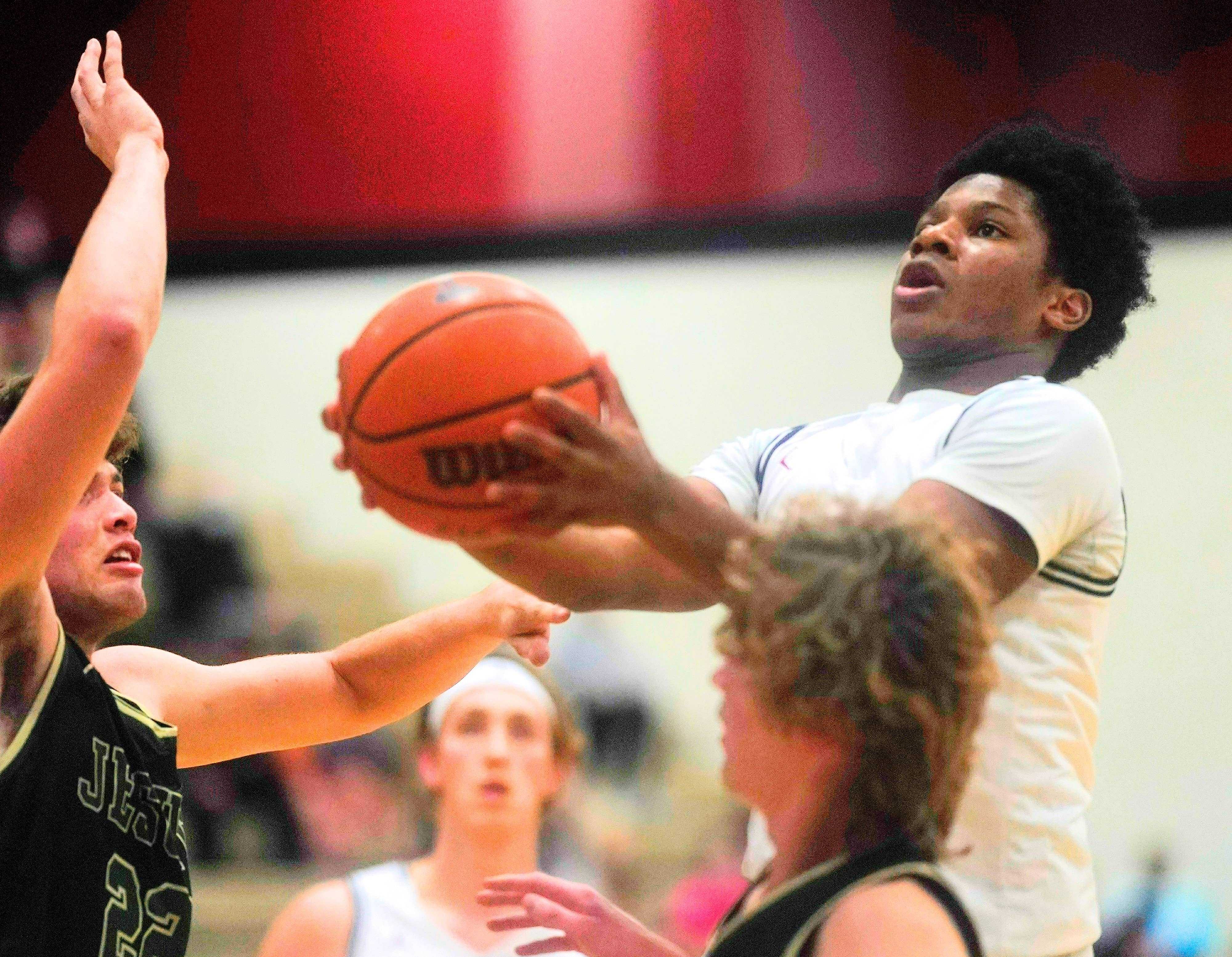 Tualatin senior guard Malik Ross, a third-year starter, is averaging 14.8 points and 5.6 rebounds. (Photo by Jon Olson)