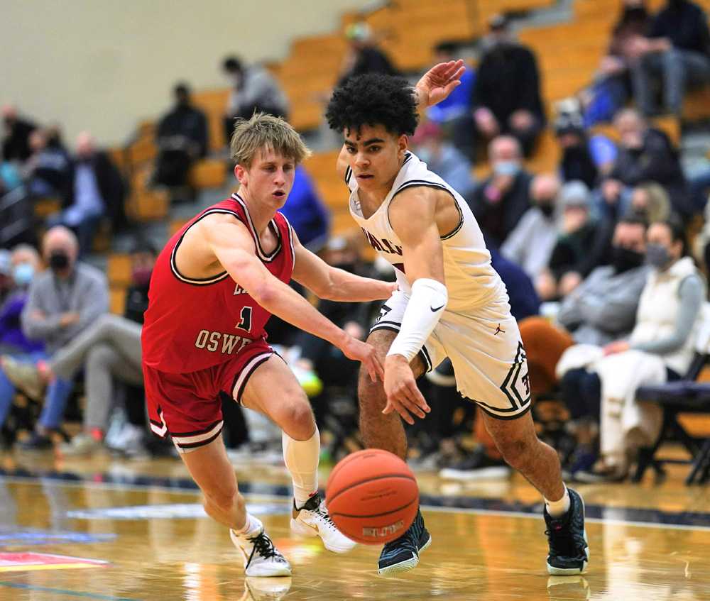 Tualatin guard Noah Ogoli fights upcourt against LO's Carson Reno (Jon Olson)