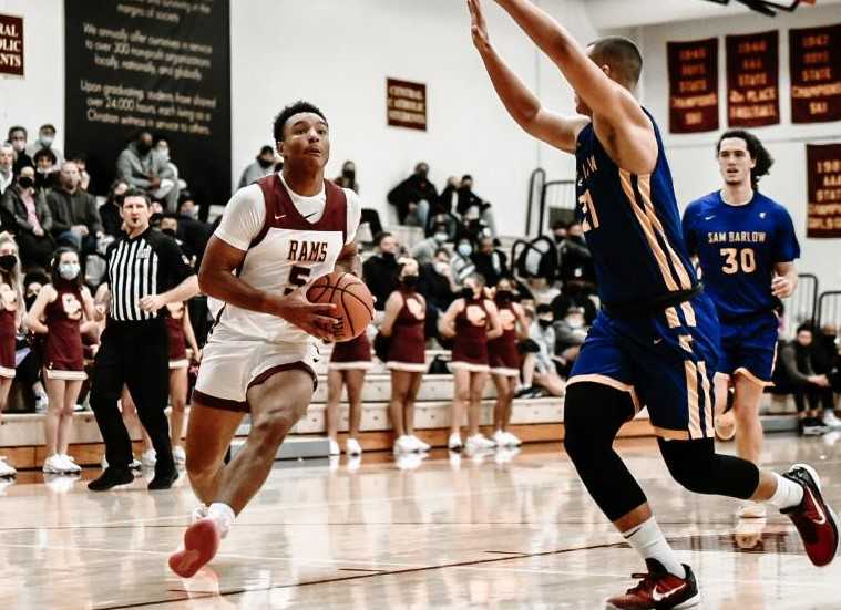 Central Catholic's Jordan King attacks the basket against the defense of Barlow's Jalen Atkins. (Photo by Fanta Mithmeuangneua)