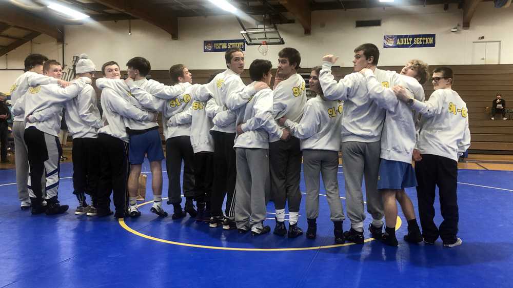 Newberg's 14 seniors show off the sweatshirts they earned, no sweat, by defeating Glencoe on Thursday