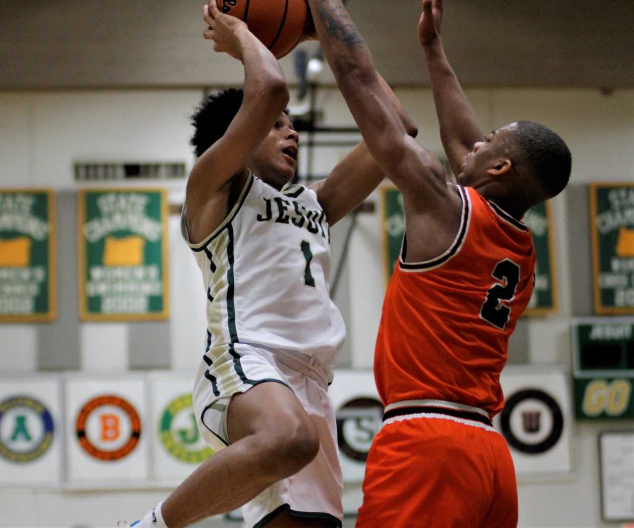 Jesuit's Isaiah Crane, shooting over Beaverton's Trevon Hamilton, scored 16 points Thursday. (Wade Evanson/Pamplin Media Group)