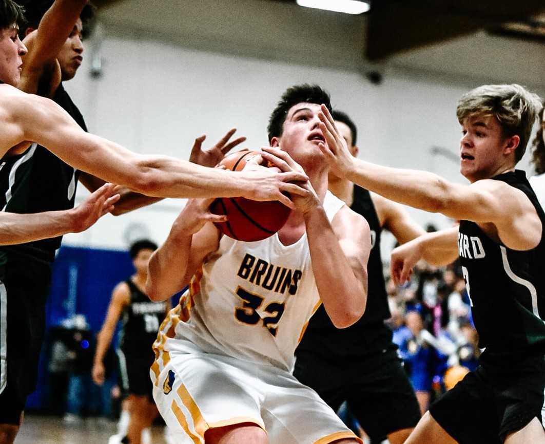 Barlow's Jesse Jones fights through the Tigard defense inside during Tuesday's 71-58 win. (Photo by Fanta Mithmeuangneua)