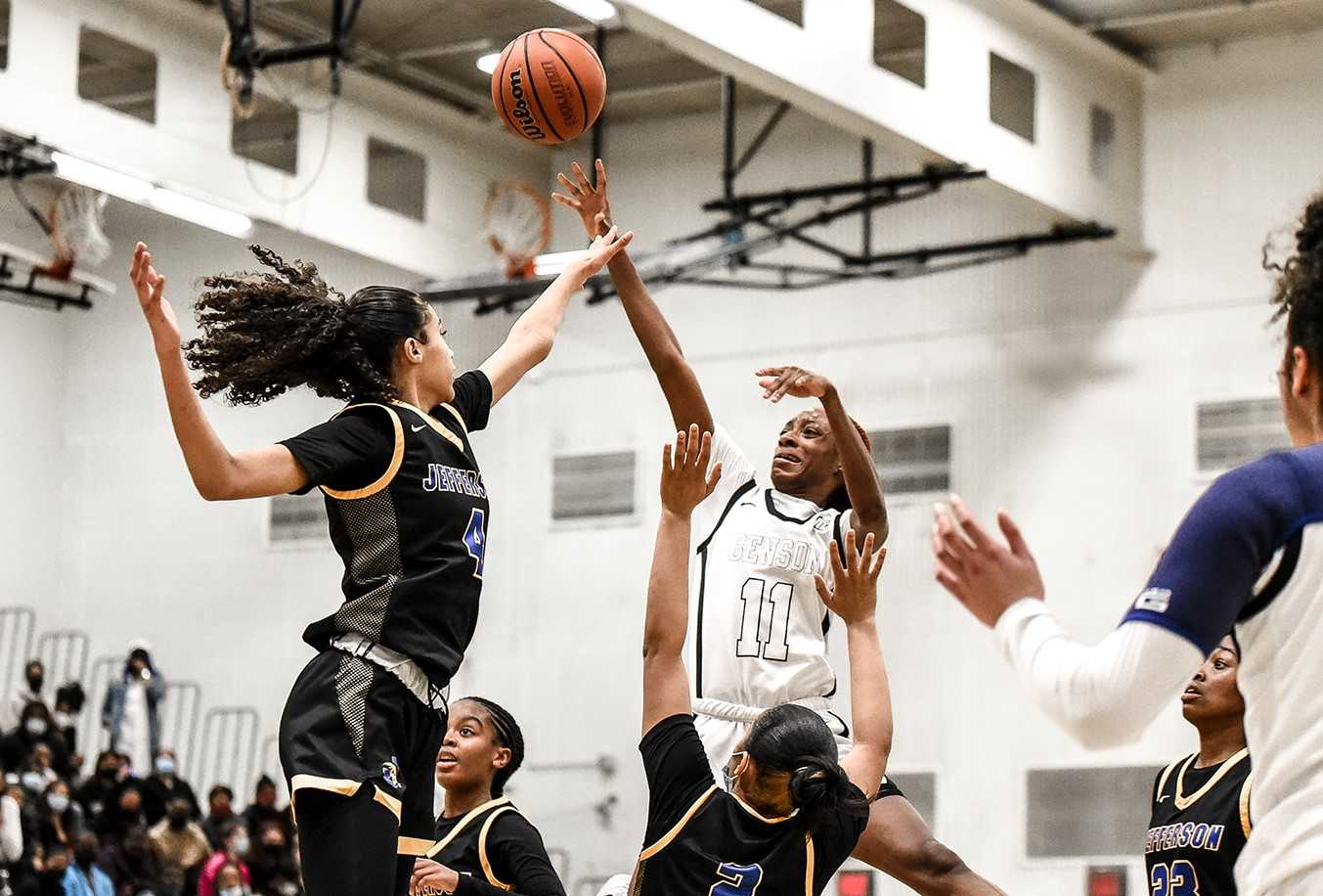 Benson's Malaya LeSueur shoots over Jefferson's Lelia Nunez in Saturday's playoff game. (Photo by Fanta Mithmeuangneua)