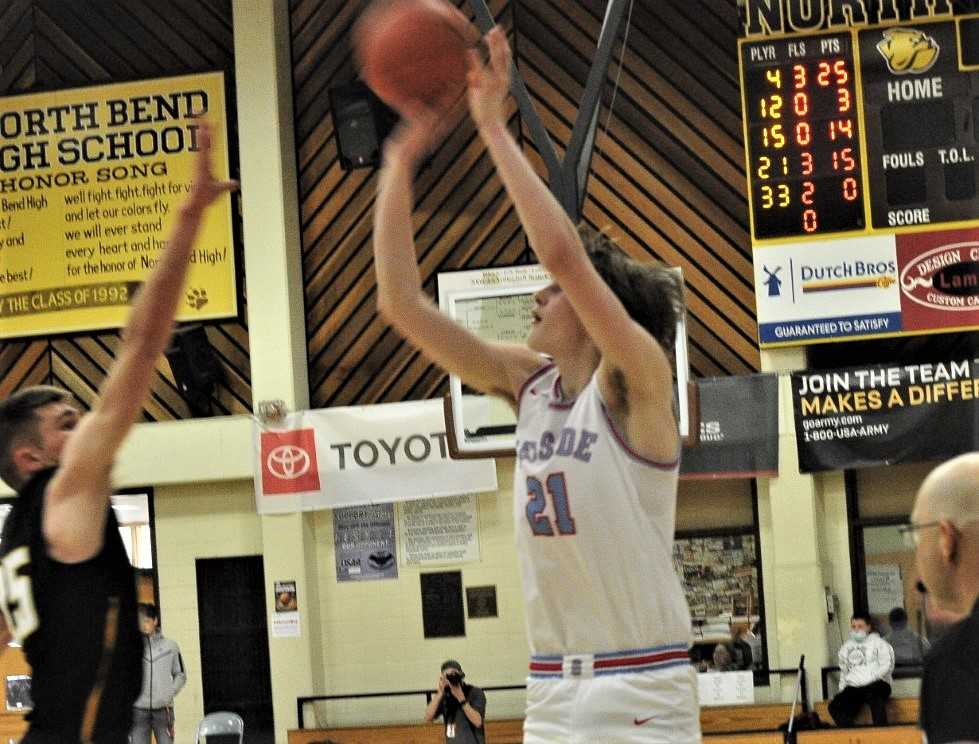 Cash Corder shoots the game-winning three-pointer in Seaside's quarterfinal win over Philomath. (John Gunther/The World)