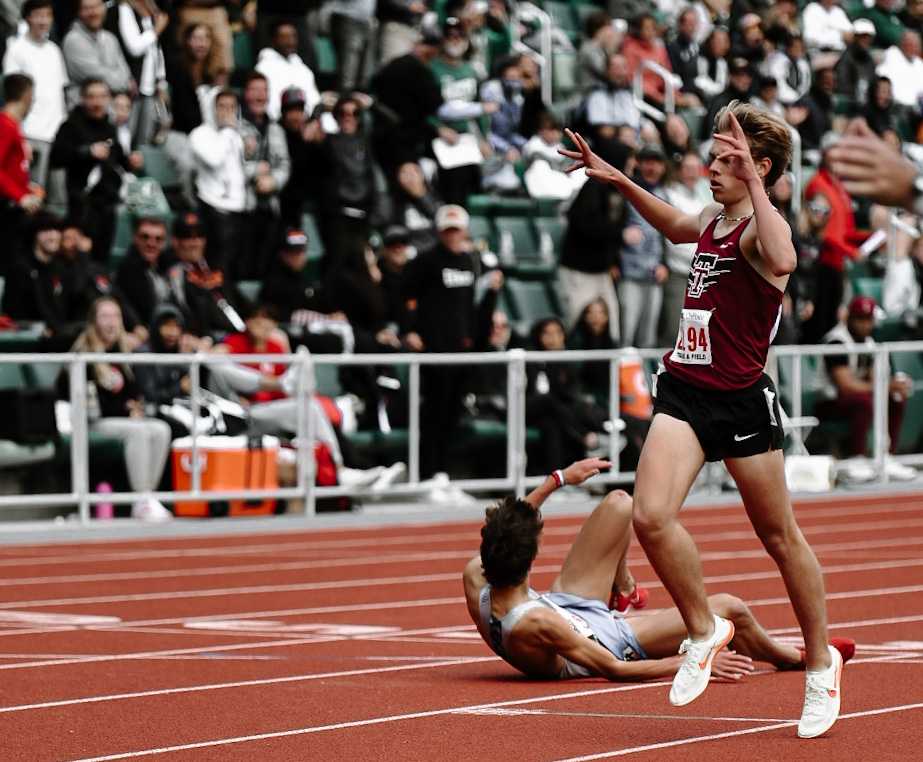 Tualatin's Caleb Lakeman celebrates his 3,000-meter win over South Medford's Michael Maiorano. (Photo by Fanta Mithmeuangneua)