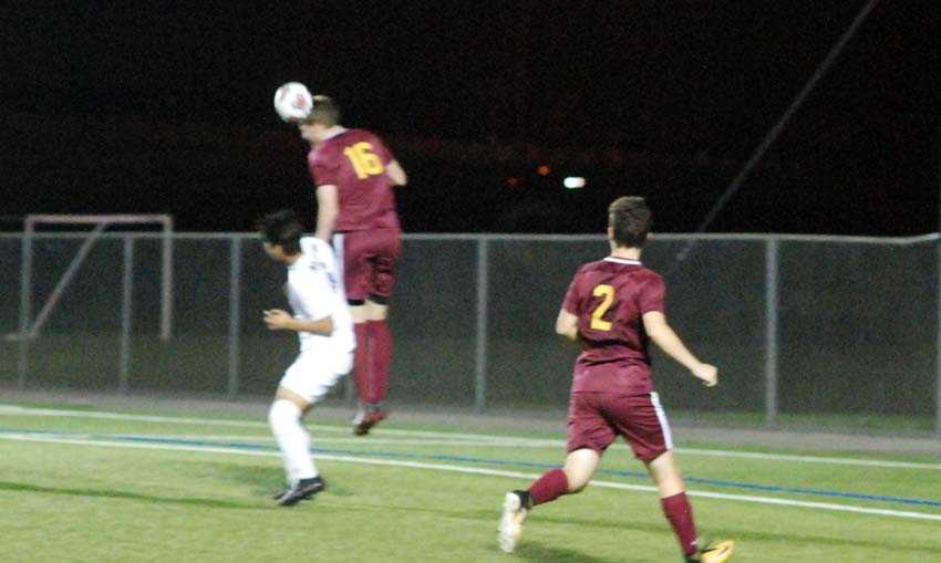 Central Catholic's Fritz Kabeiseman goes high to clear a cross in a losing effort to 17th-seeded Aloha