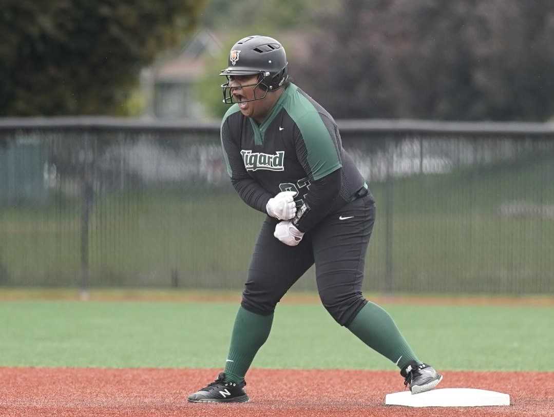 Tigard's Kani Korok celebrates after hitting a two-run double in the fifth inning Friday to make it 4-0. (Photo by Jon Olson)