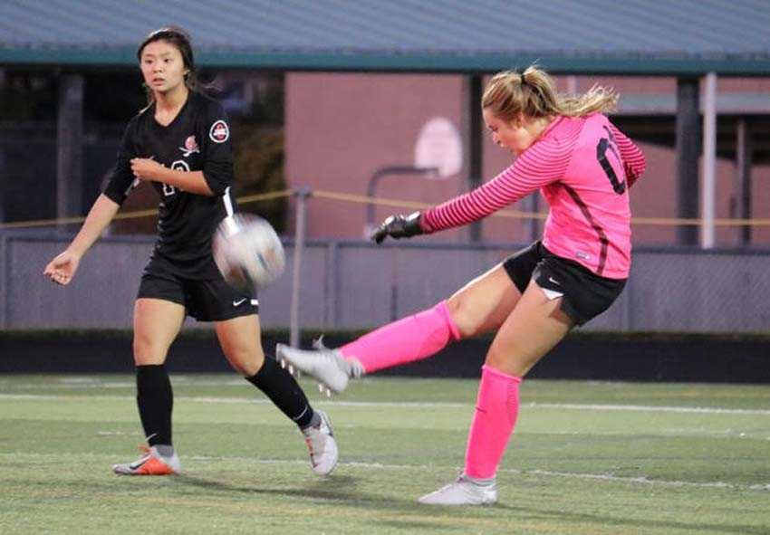 Clackamas goalie Hallie Byzewski punts the ball away while Remie Le looks on in an older photo captured by Amber Cordry-Martinez