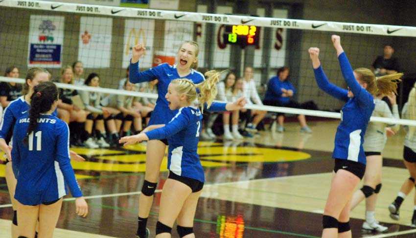 Valley Catholic celebrates a big win over La Grande on Friday afternoon