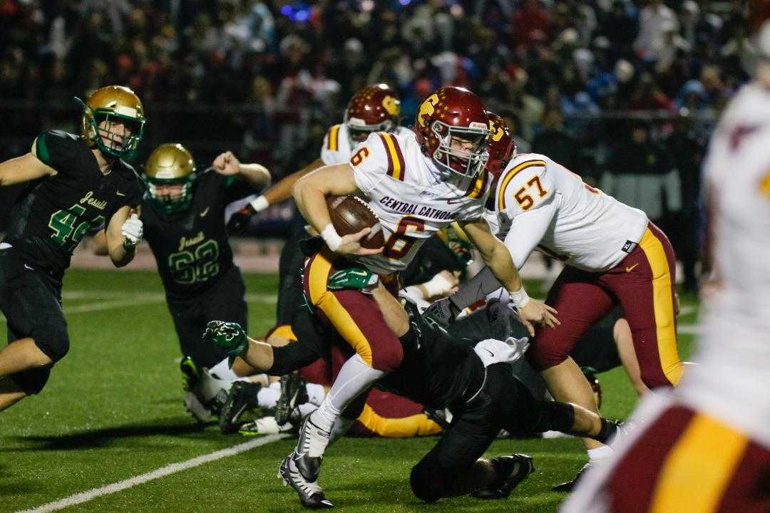 Central Catholic quarterback Cru Newman ran for 95 yards in a quarterfinal win at Jesuit on Friday. (Photo by Jim Nagae)