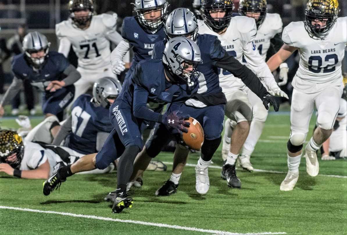 Wilsonville's Cooper Hiday (4) returned a fumble 70 yards for a touchdown in the first half Friday. (Photo by Greg Artman)