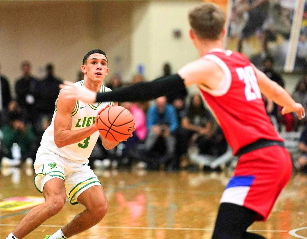 West Linn's Jackson Shelstad, shooting over Duncanville's Jackson Prince, had 30 points in the LSI final. (Photo by Jon Olson)