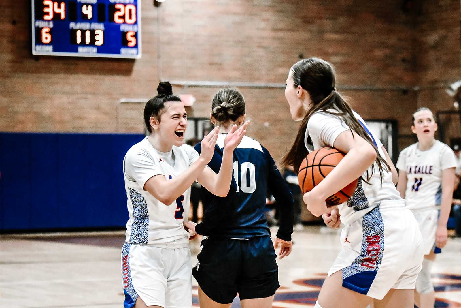 La Salle Prep's Lindsey Kapanoske (left) and Ella Wedin celebrate Friday's win over Wilsonville. (Photo by Fanta Mithmeuangneua)