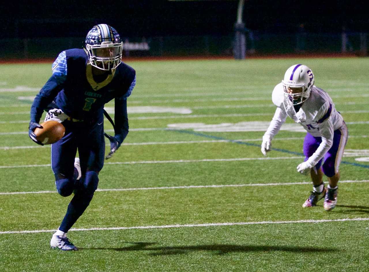 Liberty's Marquis Brown scored on a 21-yard touchdown pass in the second quarter Friday night. (Photo by Norm Maves Jr.)