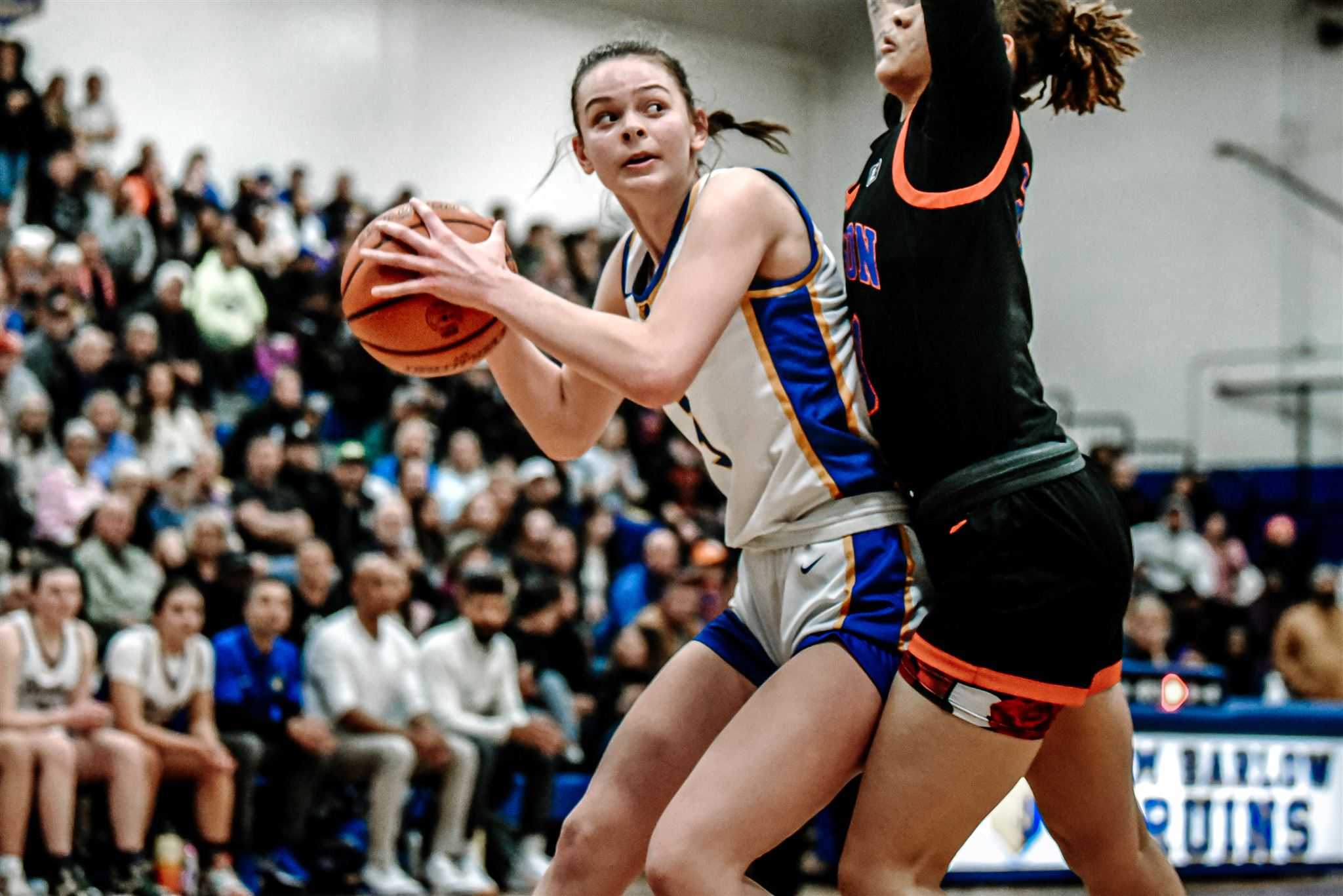 Barlow's Annie Koenig, battling with Benson's Onna Brown, scored 26 points Friday night. (Photo by Fanta Mithmeuangneua)
