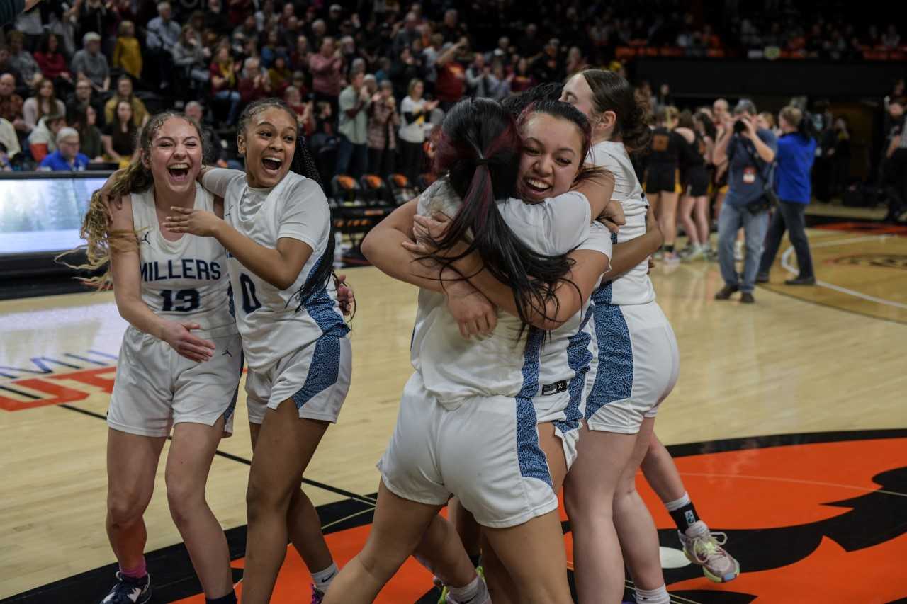 Danaeja Romero Ah-Sam gives her sister, Darissa, a bear hug after Springfield's 5A title win over Crescent Valley (Greg Artman)