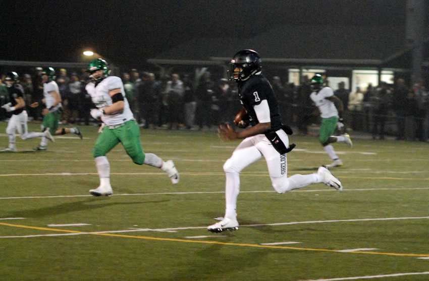 Sheldon QB Michael Johnson, Jr. finds open space to scamper for an Irish first down, something he did often on Friday night.
