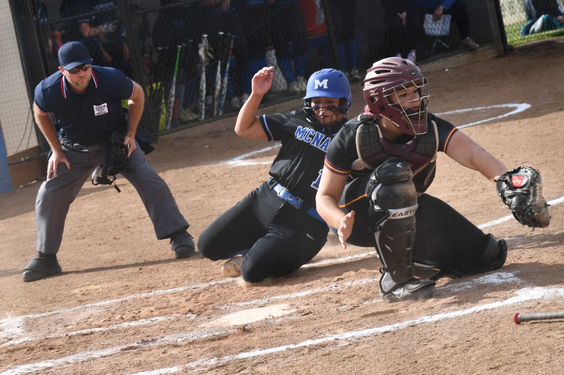 McNary's Ali Martinez, sliding safety into home, hit a two-run homer in Monday's first-round win. (Photo by Jeremy McDonald)