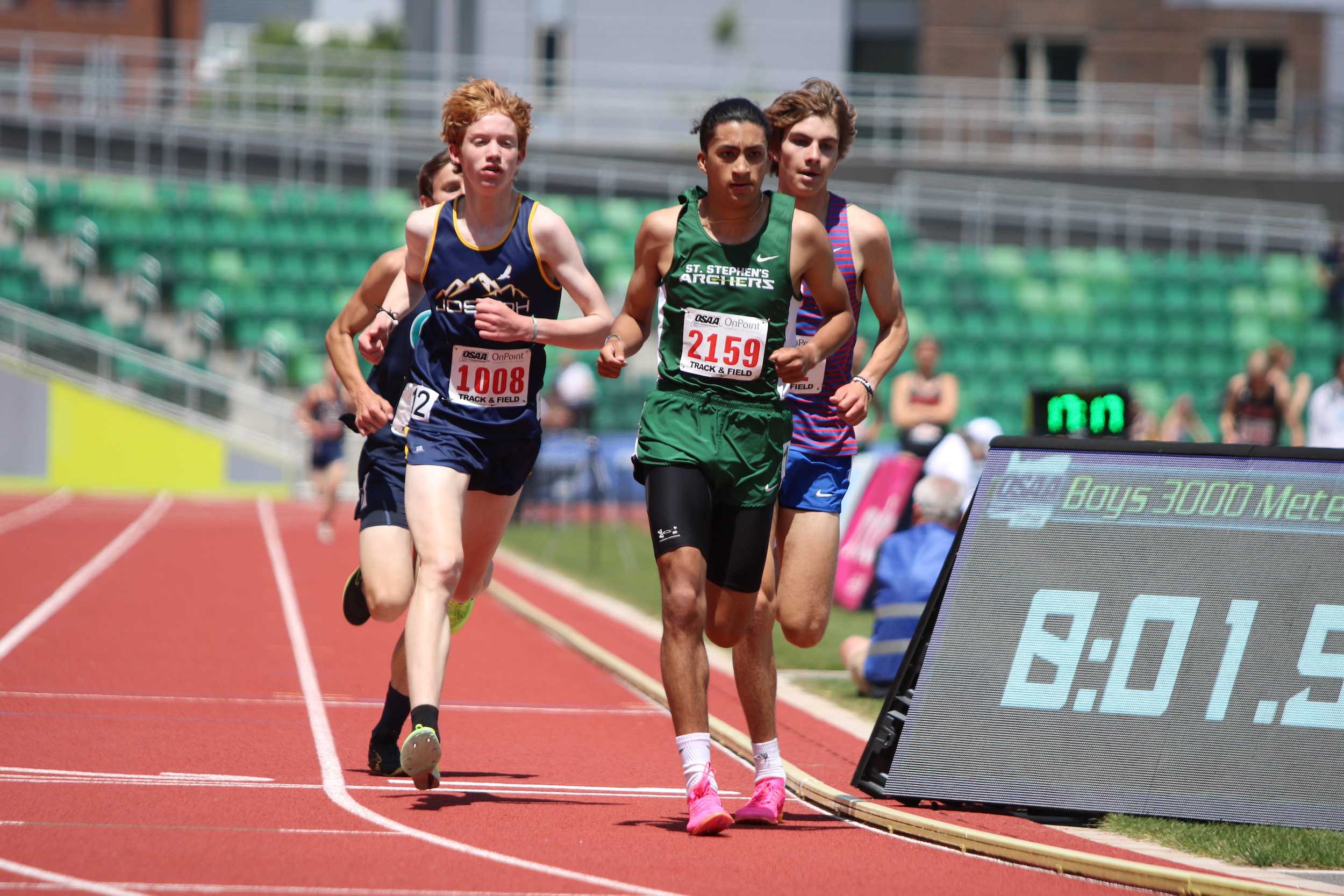 Joseph's Jett Leavitt, St. Stephen's Nathan Contreras, and Condon's Grady Greenwood (L to R) wage battle in the 1A boys' 3,000.