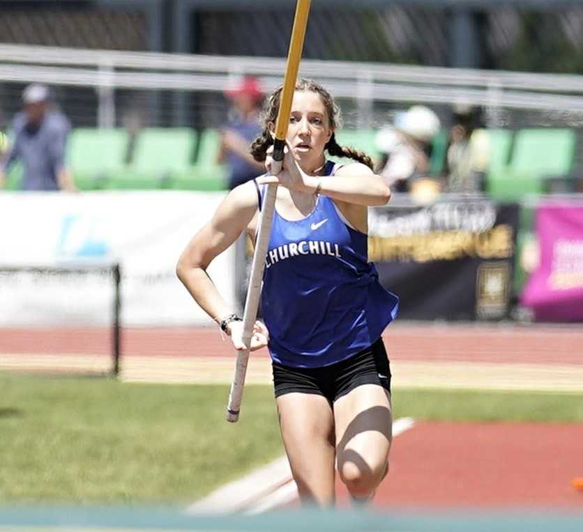 Churchill's Addison Kleinke added nearly two inches to her state record in the pole vault Friday. (Photo by Jon Olson)