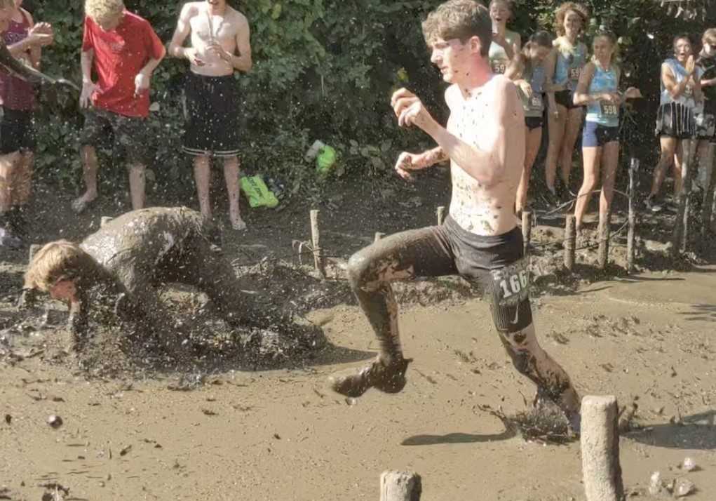 Southridge senior Collin Penuel trudges through the mud during the Ultimook Race on Saturday. (Photo by Ryan Jones)