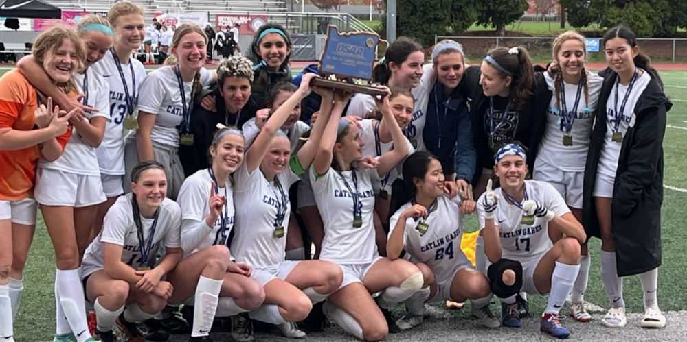 Catlin Gabel, with Holland Swan far left, celebrates its state title one year after losing in the final