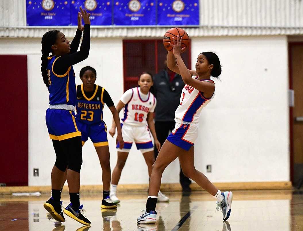 Benson's Eboni Clay (right) looks to pass around the defense of Jefferson's Abrianna Lawrence. (Photo by Fanta Mithmeuangneua)