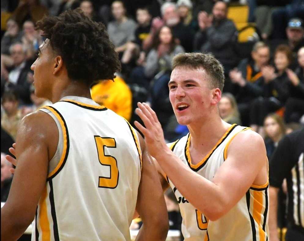 Landon Knox (right), with Anthony Best (5), scored 17 points in Cascade's 59-51 win over Baker. (Photo by Jeremy McDonald)