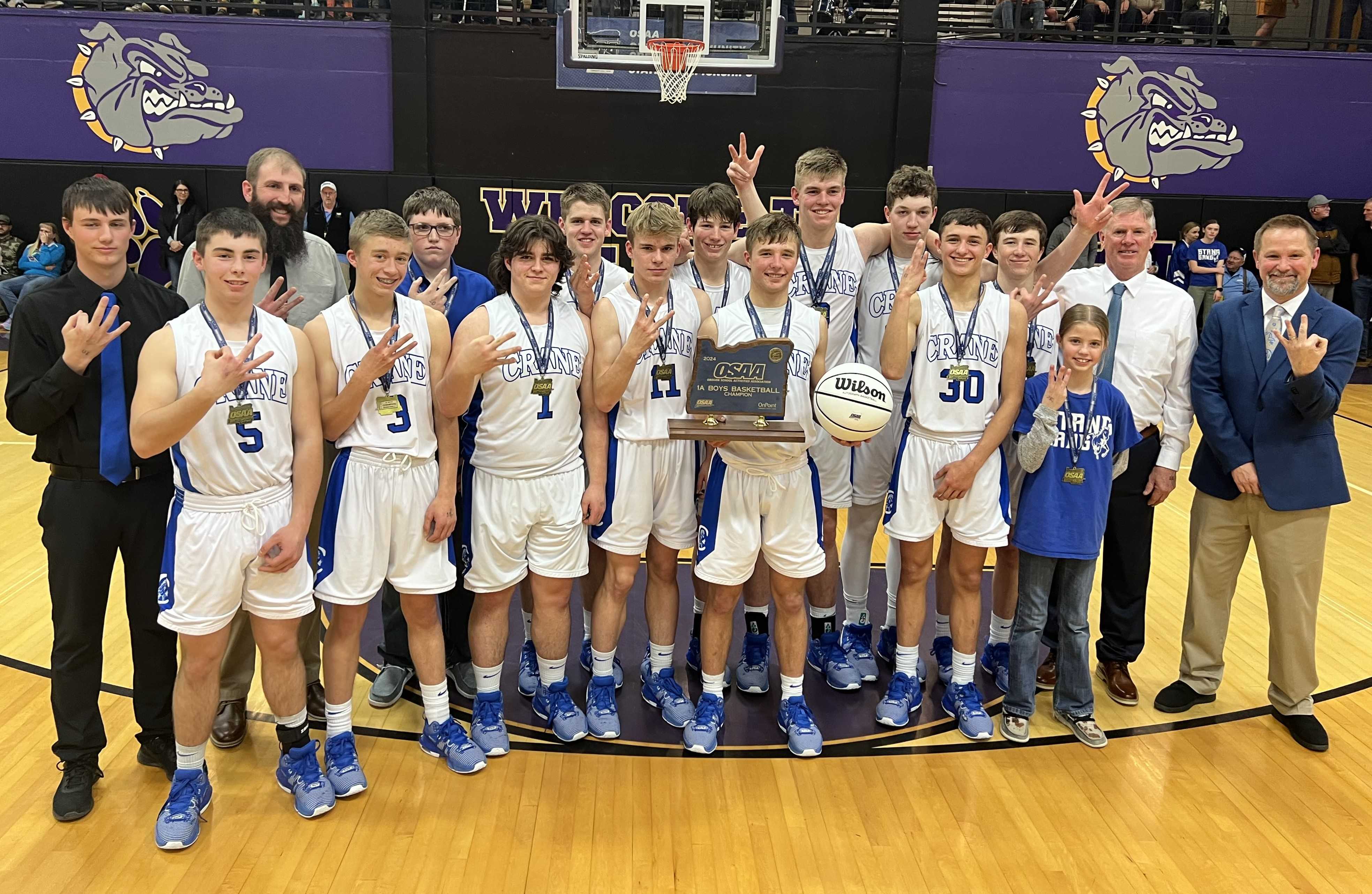 Crane celebrates winning its third consecutive 1A championship Saturday night at Baker High School.