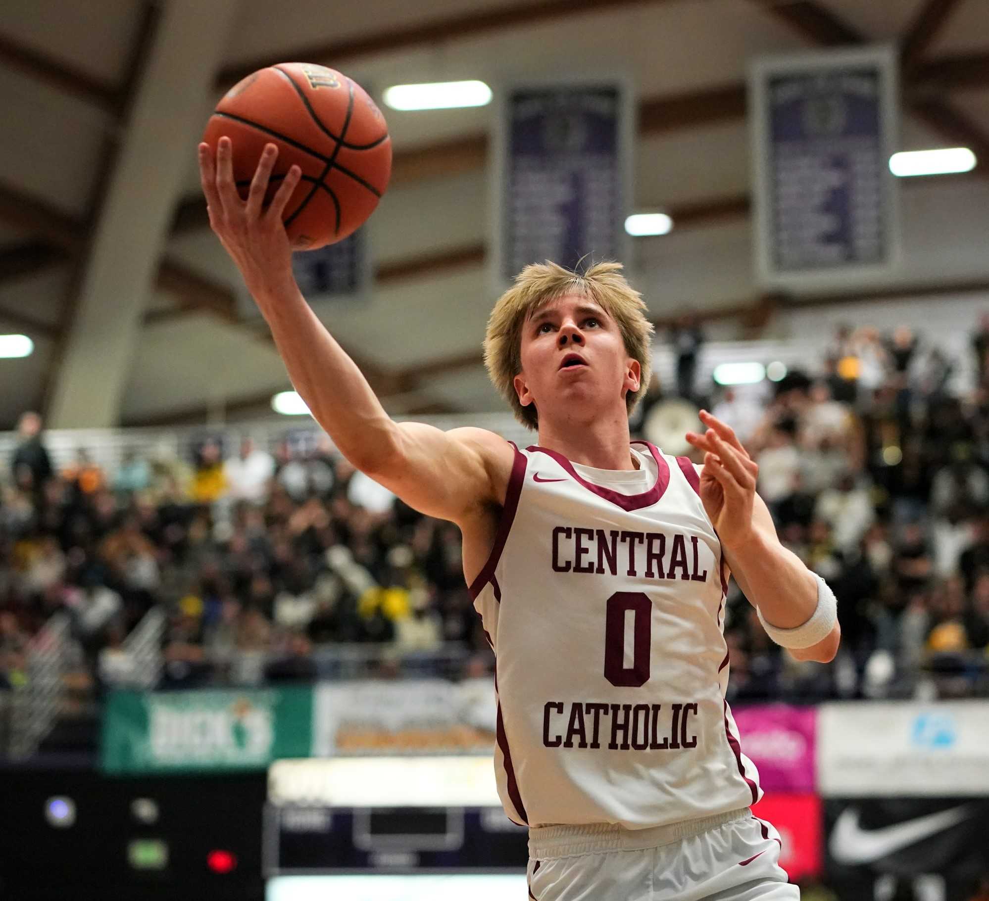 Central Catholic junior Isaac Carr goes up for two of his game-high 26 points in Saturday's 6A final. (Photo by Jon Olson)