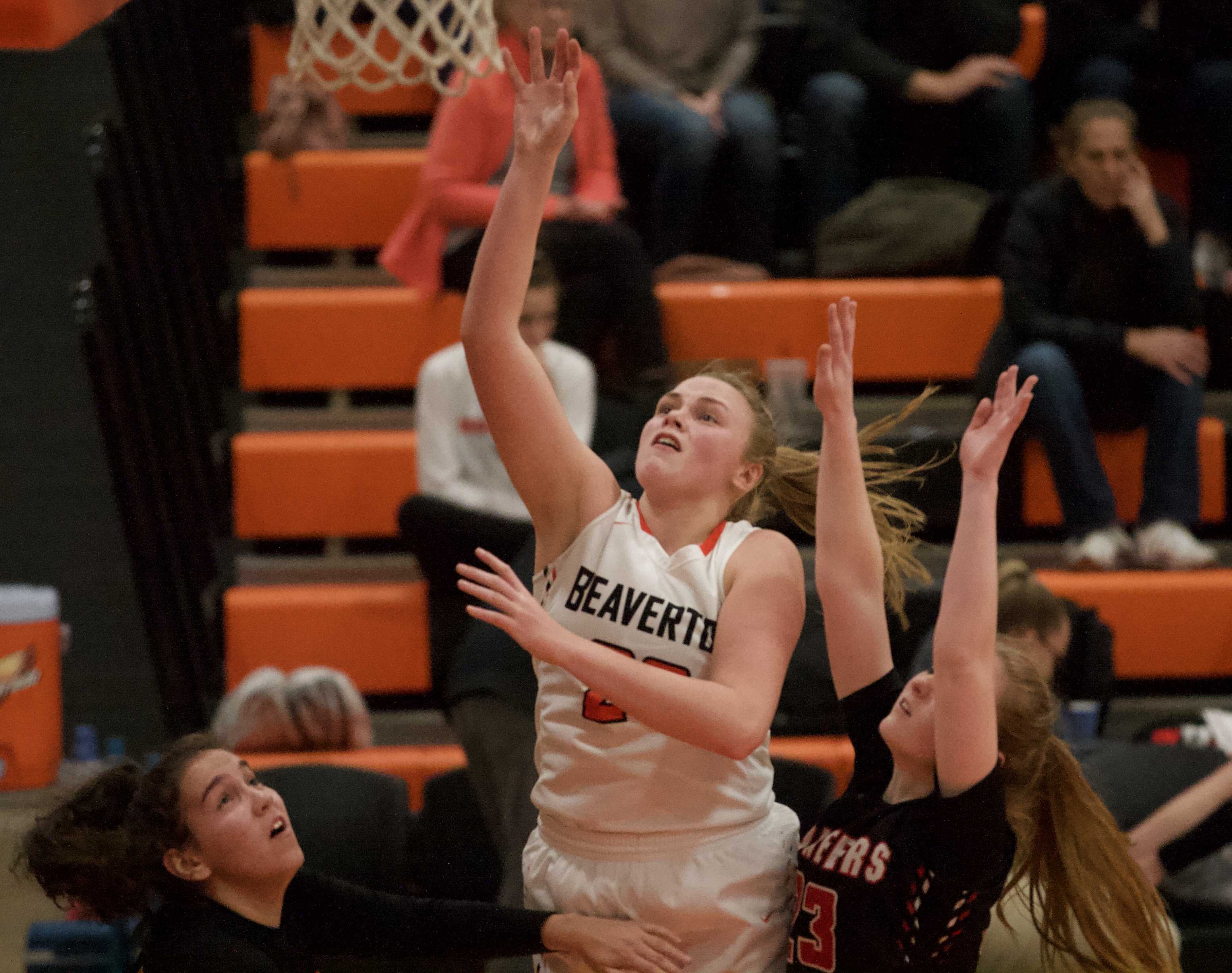 Beaverton post Laura Erikstrup picks up two of her game-high 16 points against Oregon City. (Photo by Norm Maves Jr.)