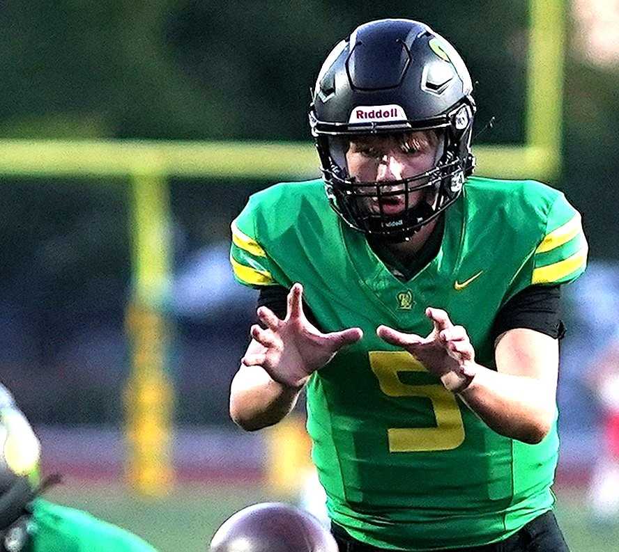 West Linn quarterback Baird Gilroy's touchdown run with 49 seconds left lifted the Lions over Sumner. (Photo by J.R. Olson)