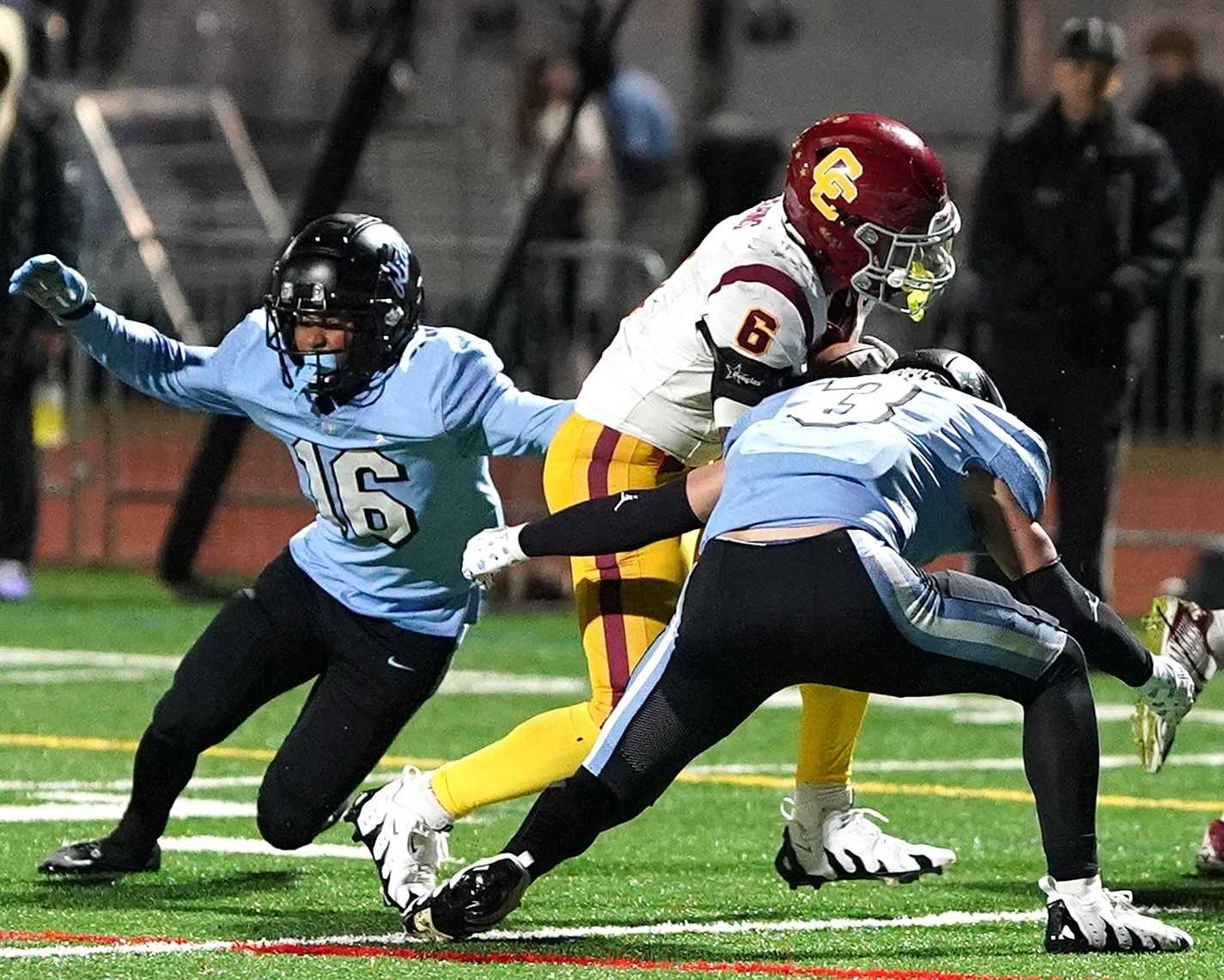 Central Catholic's Tyson Davis (6) collides with Lakeridge's Marcus Post (3) in Friday's quarterfinal game. (Photo by J.R.Olson)