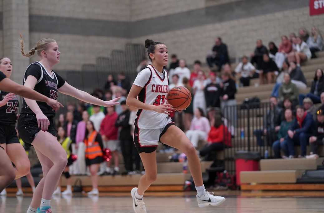 Clackamas' Jazzy Davidson drives past Willamette's Jadynn Ireland in Tuesday's nonleague game. (Photo by Ryan Slider)