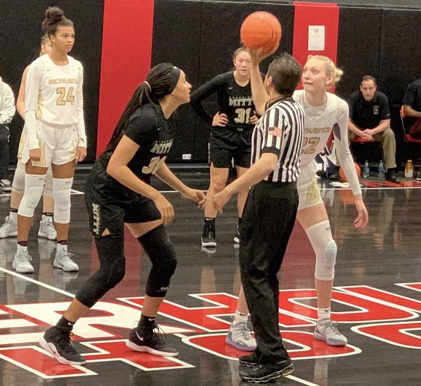 Southridge's Cameron Brink (right) jumps against Archbishop Mitty's Haley Jones.