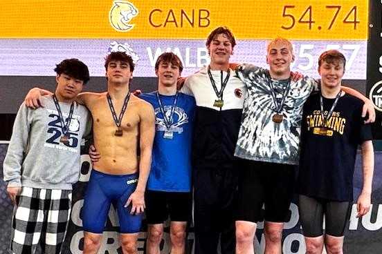 Caldera's Campbell McKean (third from right) ends his high school career with six individual titles. (Photo by J.R. Olson)