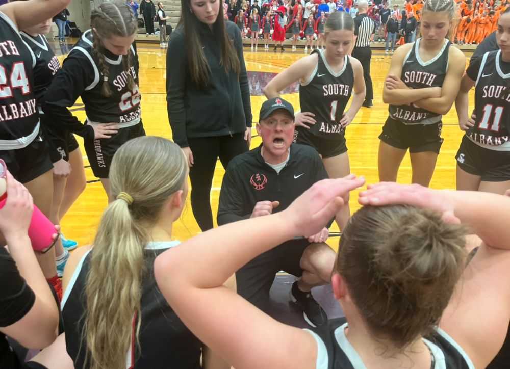 South Albany coach Marc Cordle speaks with his team late in the Silverton semi in a way that underscores the game's intensity