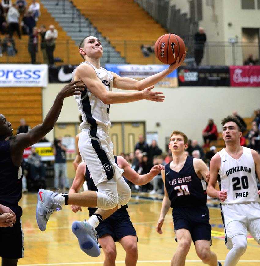 Gonzaga Prep wing Liam Lloyd finishes in traffic. Photo by Jon Olson