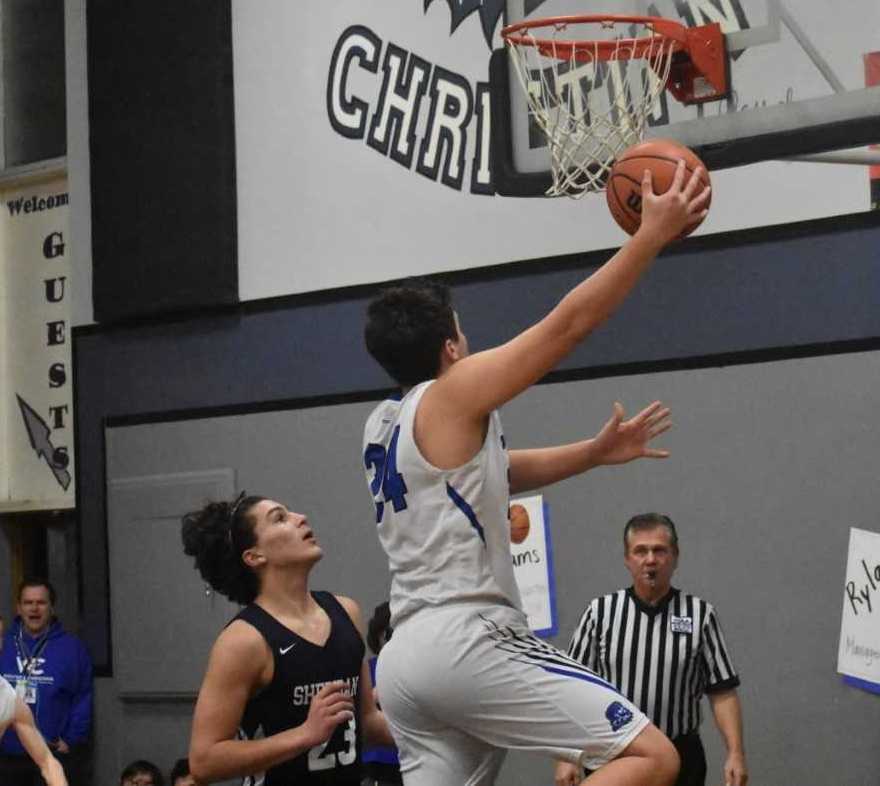 Ethan Halgren goes up for two points in Western Christian's win over Sheridan on Wednesday. (Photo by Jeremy McDonald)