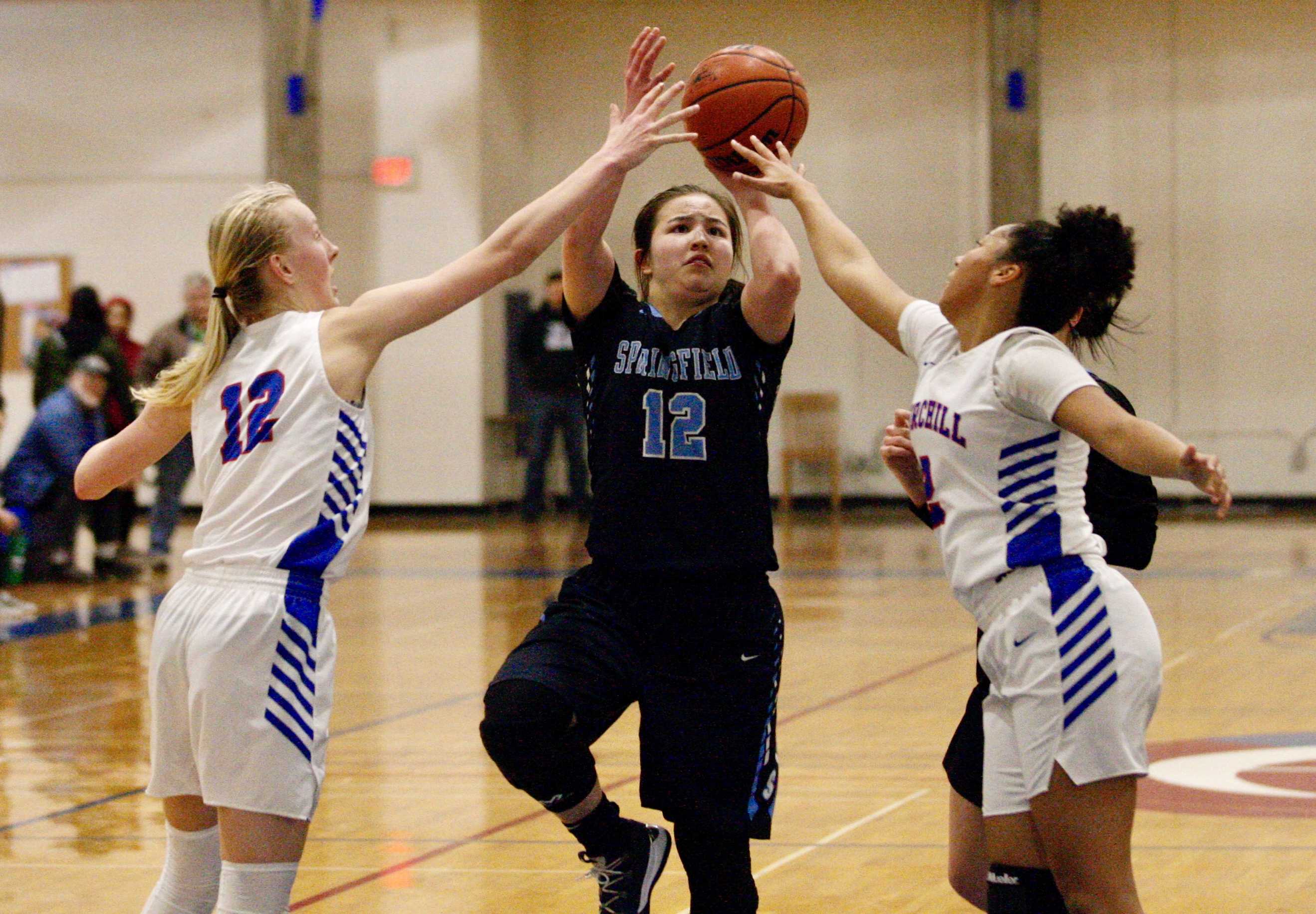 Springfield's Becca Durbin goes up between Dani Starr (12) and Isis Smith of Churchill for two of her game-high 19 points