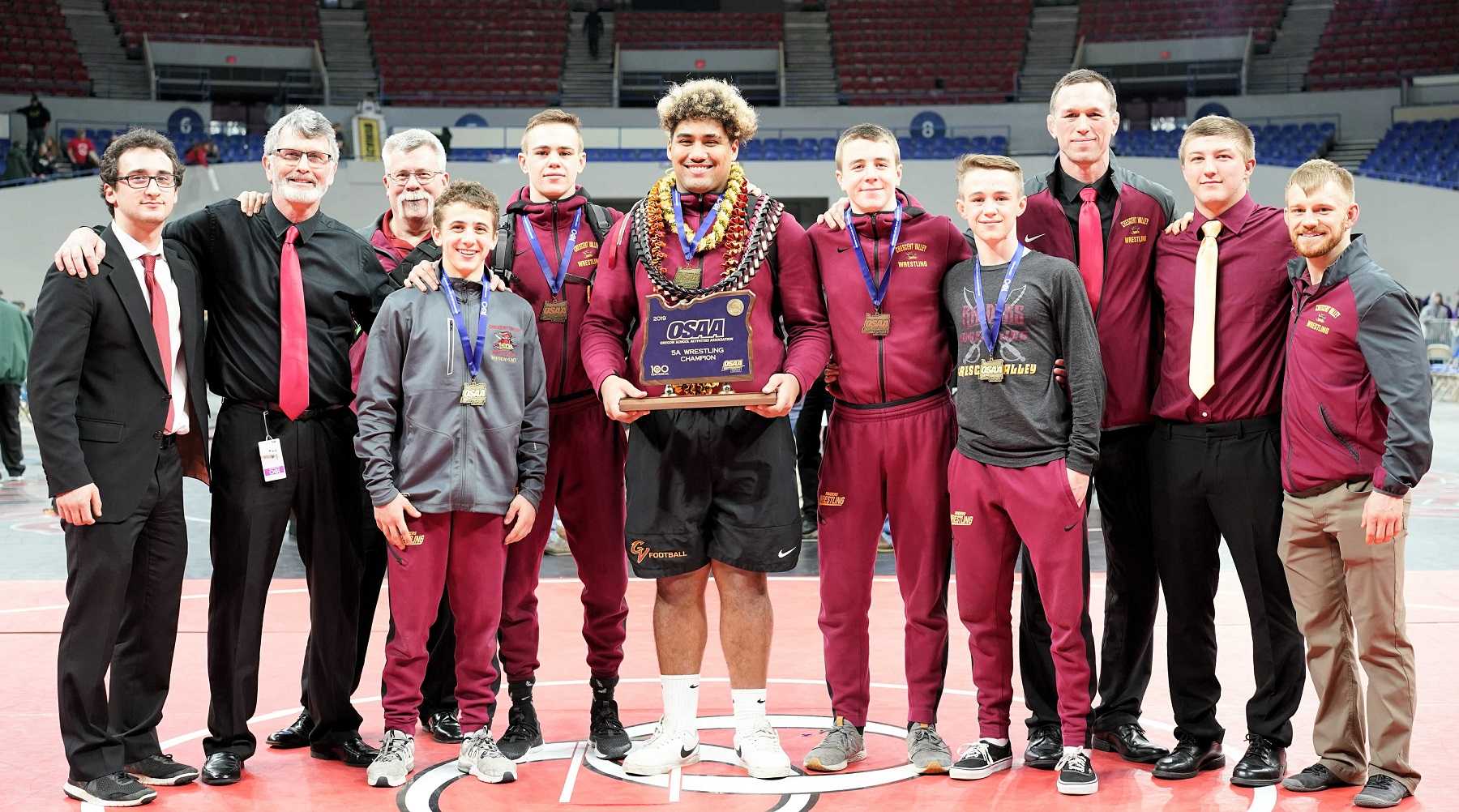 Kaimana Wa's holds Crescent Valley's first championship trophy. (Photo by Jon Olson)