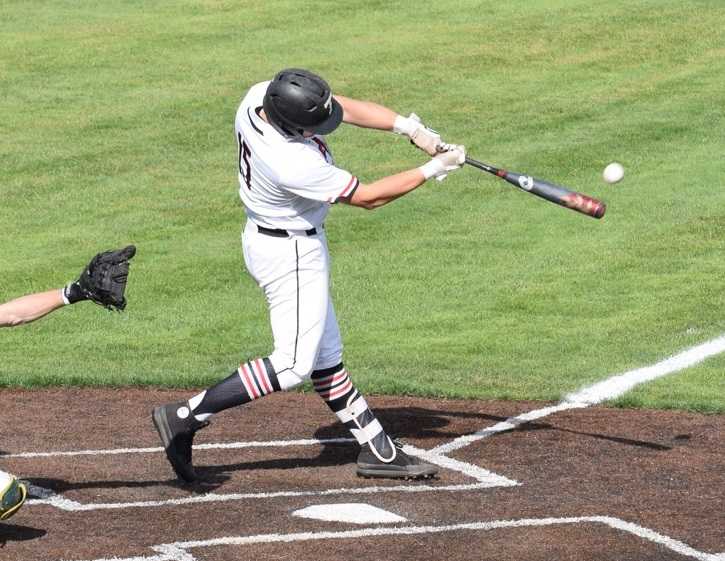 Thurston's Cade Crist connects for one of his two home runs. Photo by James Underwood
