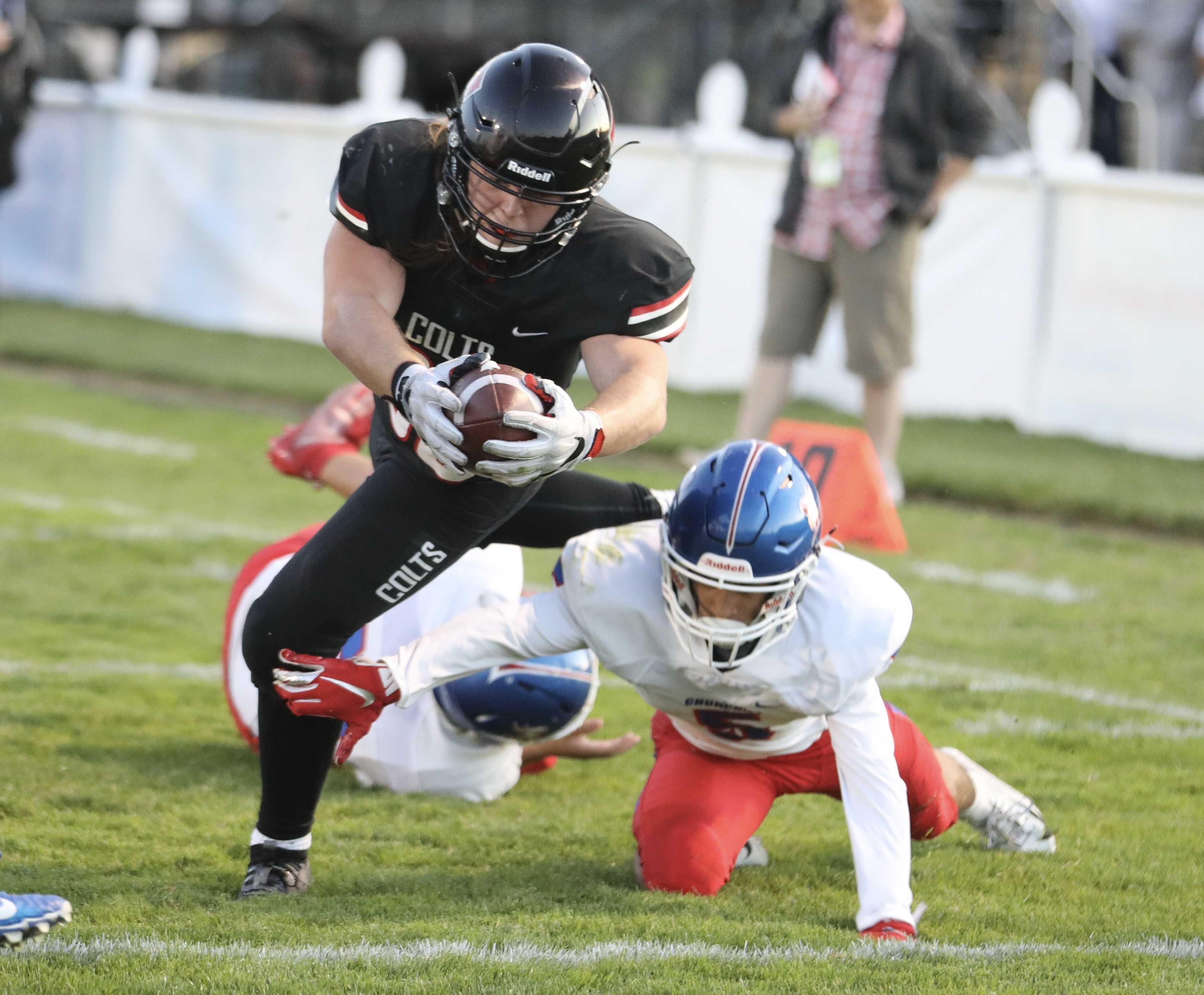 Thurston senior Wes Kommer scores the first of his three touchdowns in the Colts' 55-0 romp over Churchill (Norm Maves Jr.)