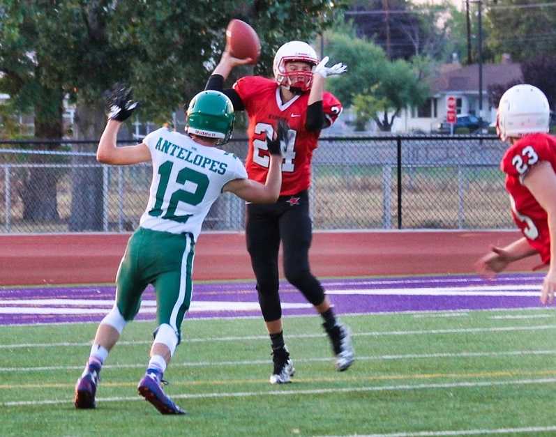 Kort Skinner (12) of Adrian/Jordan Valley pressures Dufur QB Cooper Bales. (Photo by Robert Wallace)